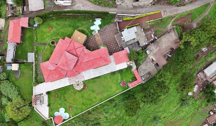 Aerial drone view of Highland Lodges Balakot, showing the full scale of the gated grounds