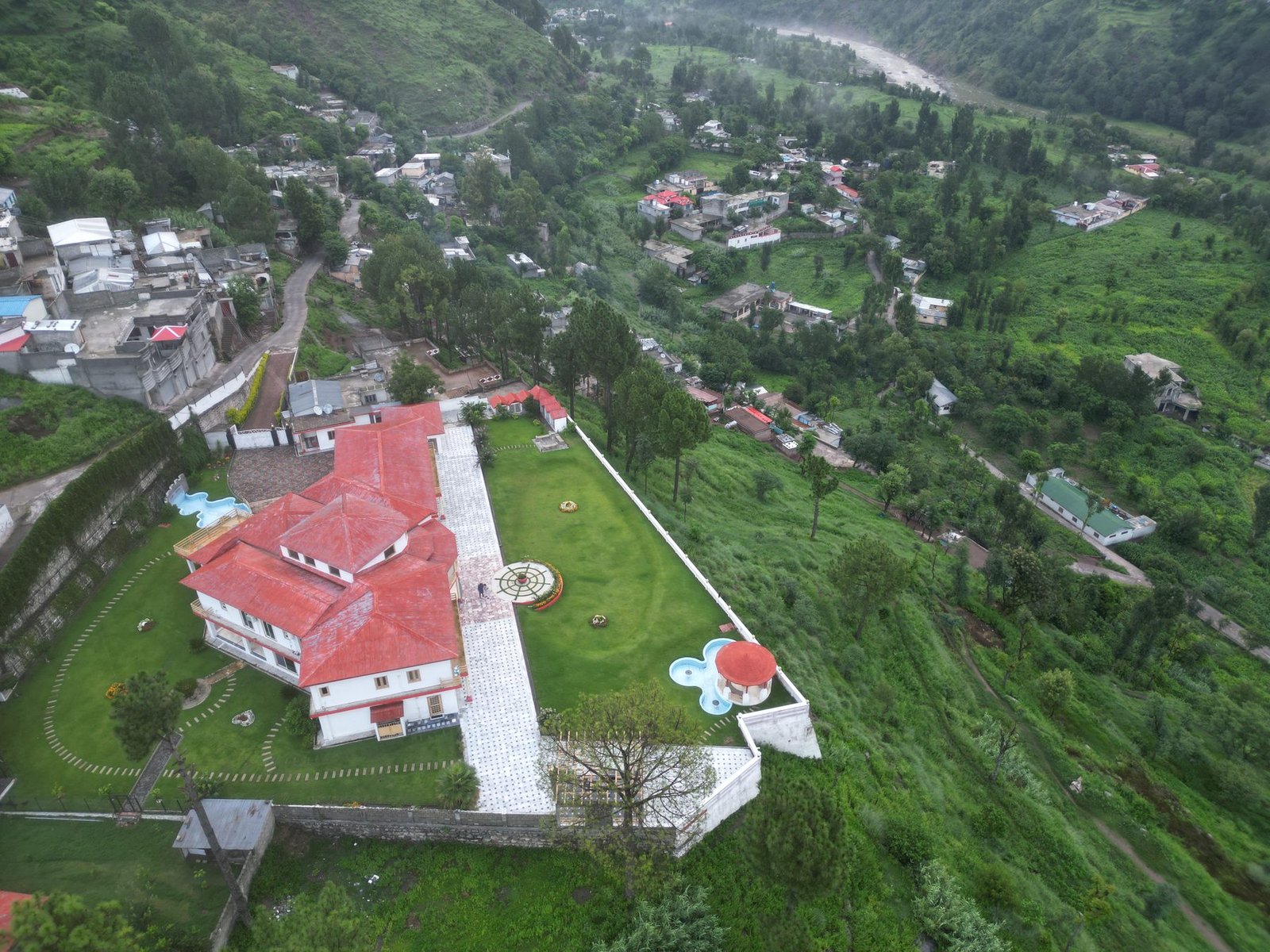 Aerial drone view of Highland Lodges Balakot estate and surrounding valley