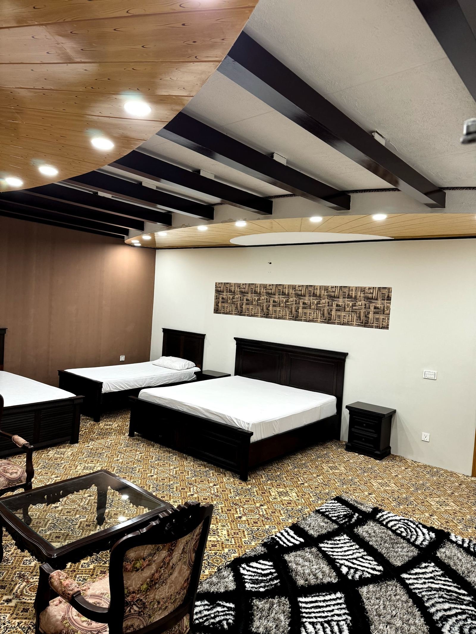 Quad Bed Room with two double beds and seating area